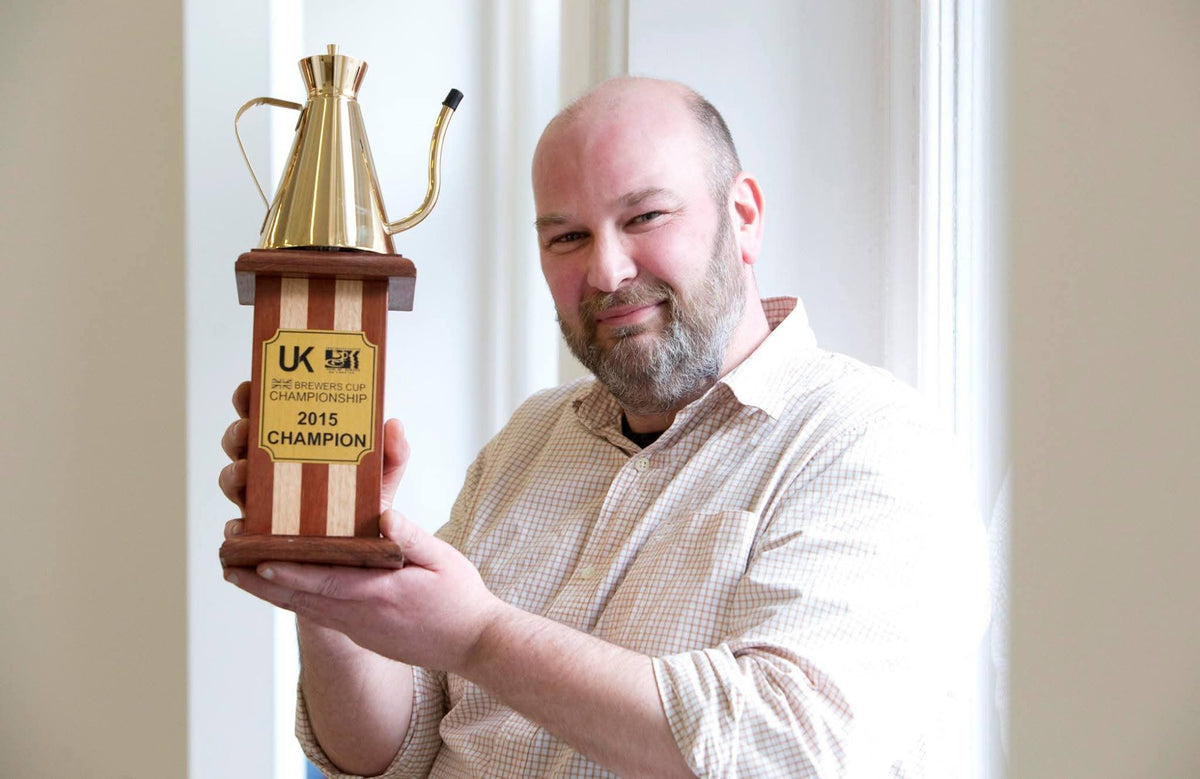UK Brewers Cup Champion Gordon Howell holding his championship trophy in 2015