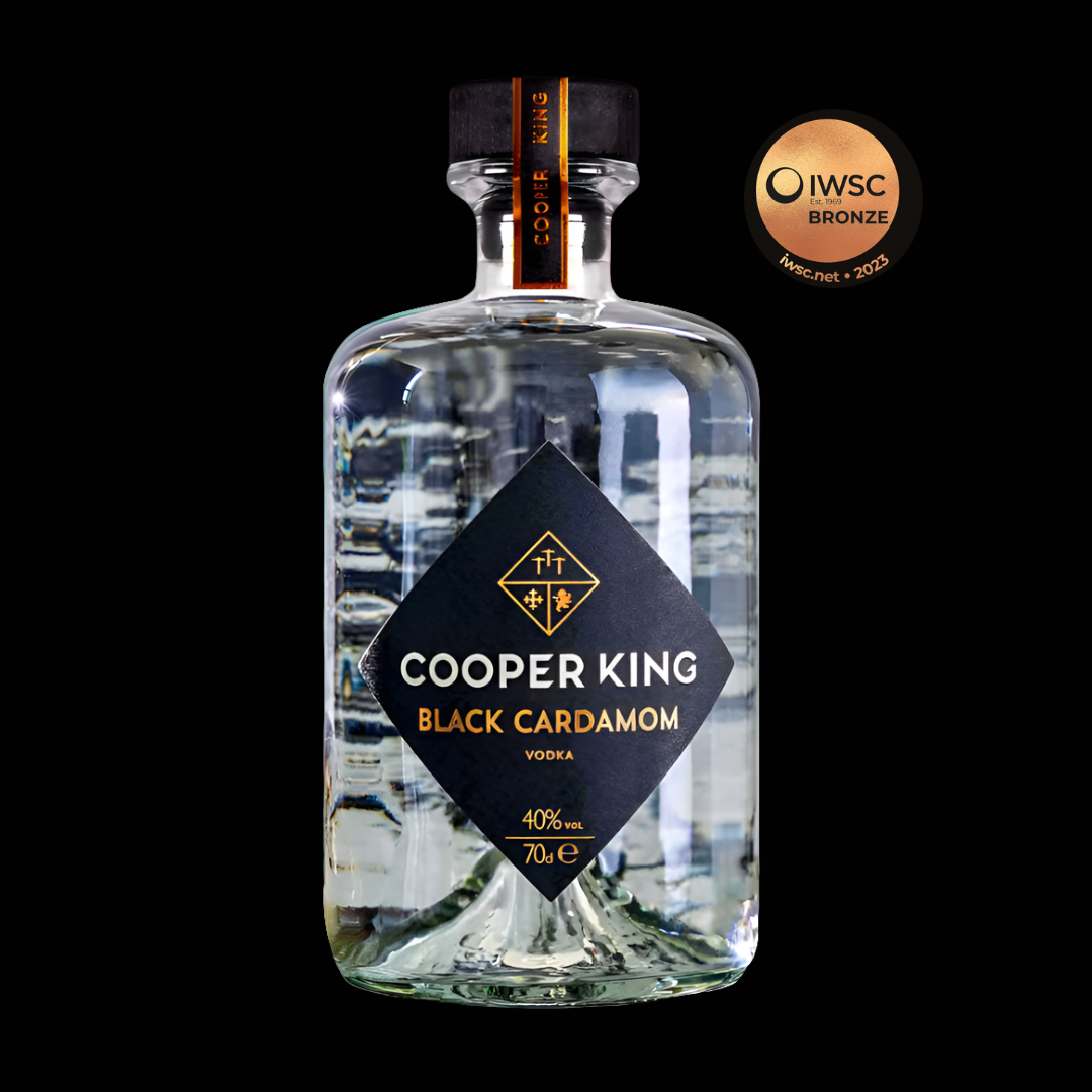 Cooper King Black Cardamom Vodka bottle with IWSC Bronze award on a black background
