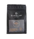 Black coffee packaging with Danelaw Coffee branding on a white background